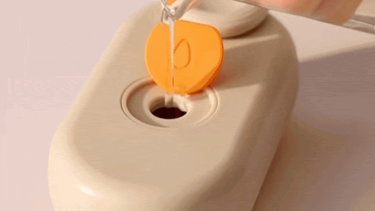 Soothing steam brush for dog and cat grooming.